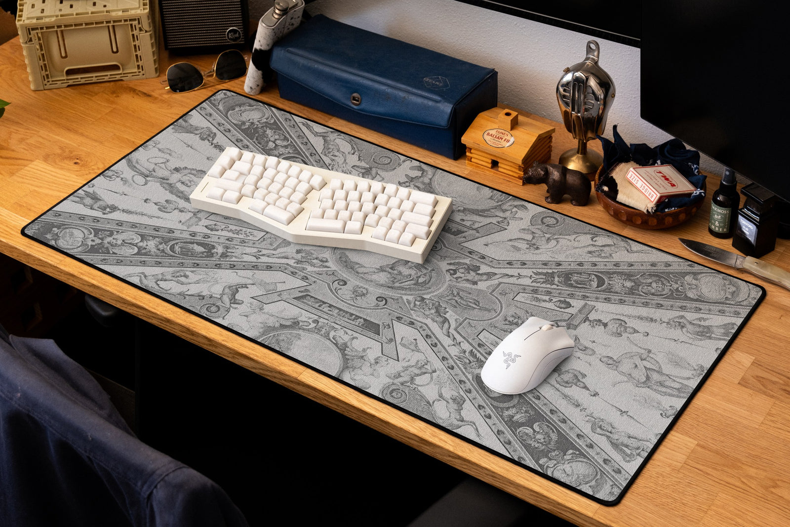 Reclining Allegory desk mat in Dark, shown on a styled desk setup