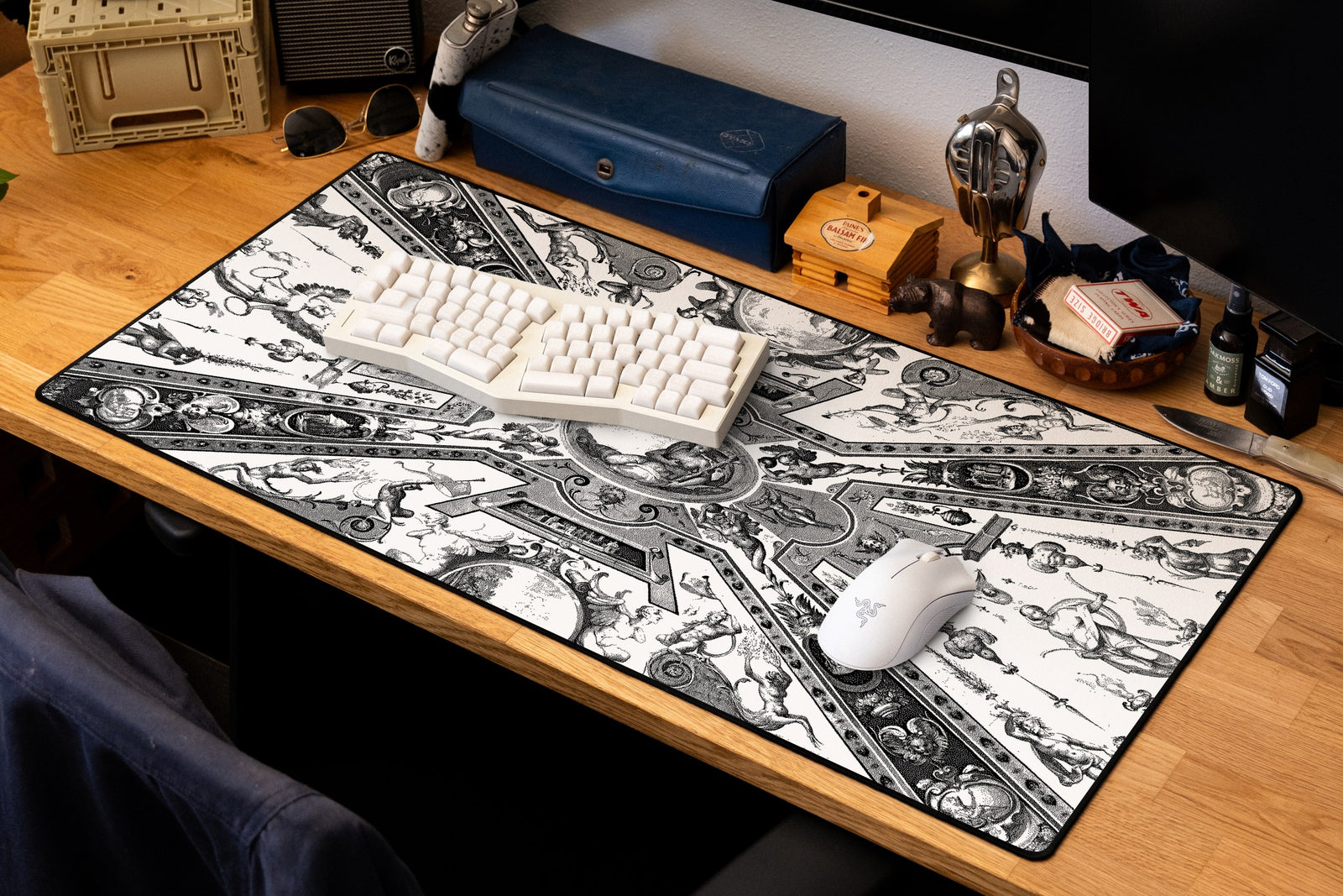 Reclining Allegory desk mat in Dither, shown on a styled desk setup