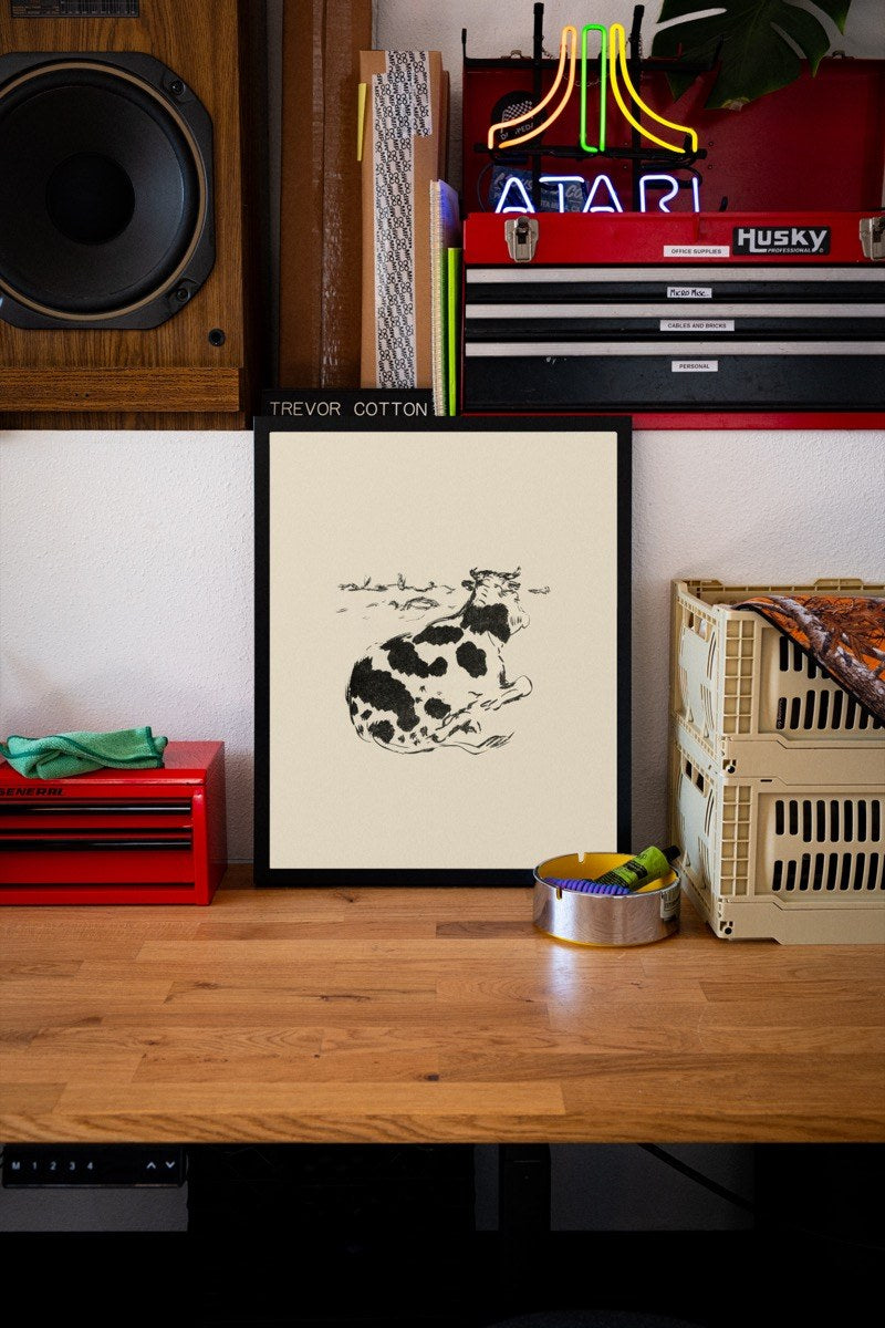 Resting Cow - Ink Sketch art print styled in a room setting