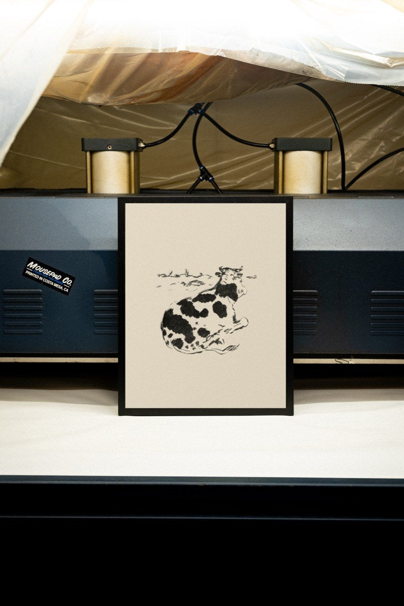 Resting Cow - Ink Sketch art print styled in a room setting