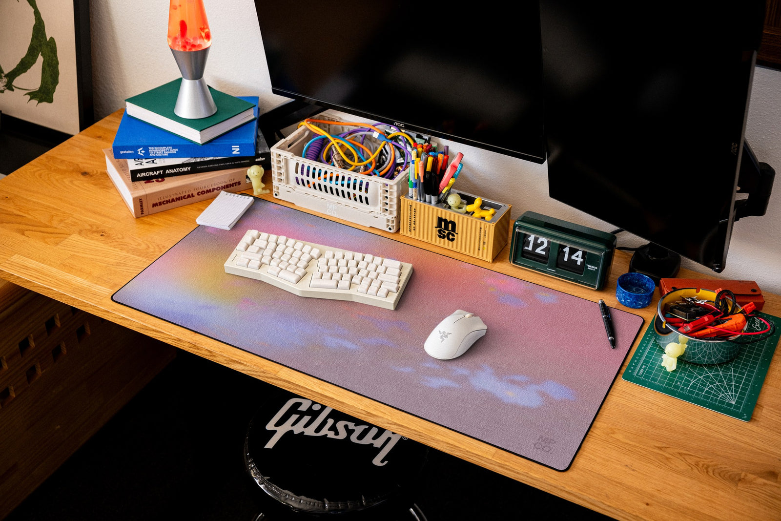 River Dust desk mat in Original, shown on a styled desk setup