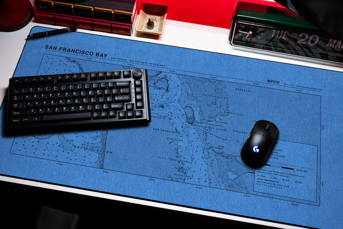 San Francisco Bay Nautical Chart Pad desk mat in Swiss Blue, shown on a styled desk setup