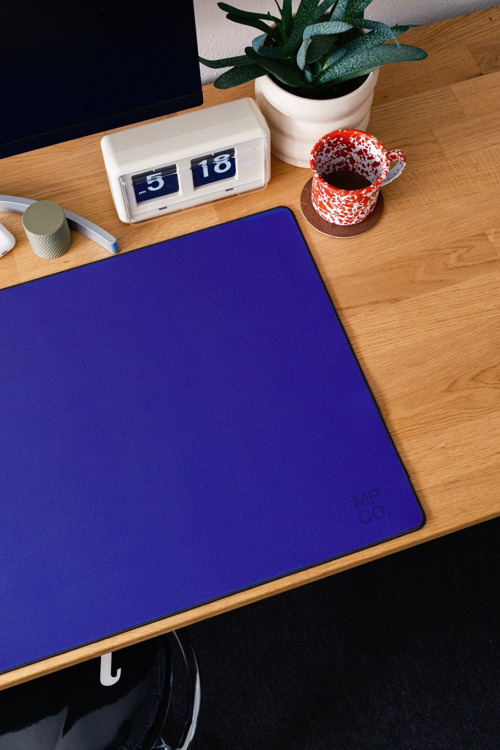 Solid Colors 2026 Summer desk mat in Blue, shown on a styled desk setup