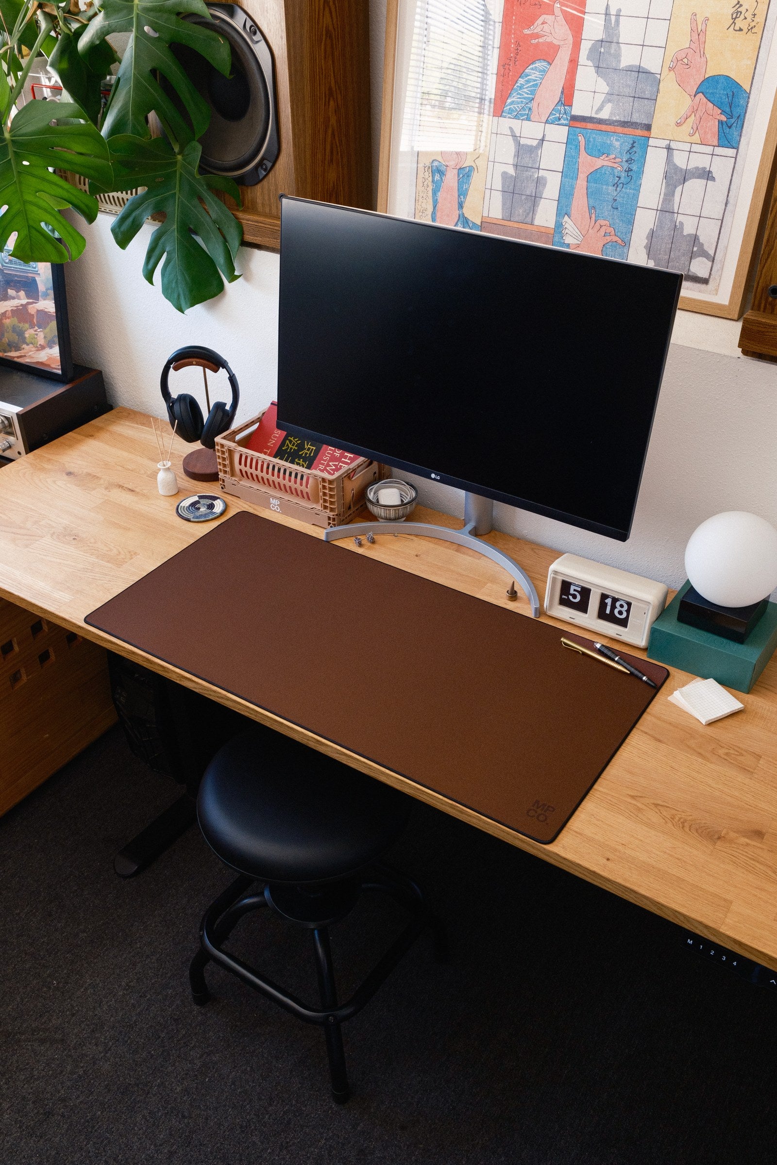 Solid Colors 2026 Summer desk mat in Espresso, shown on a styled desk setup