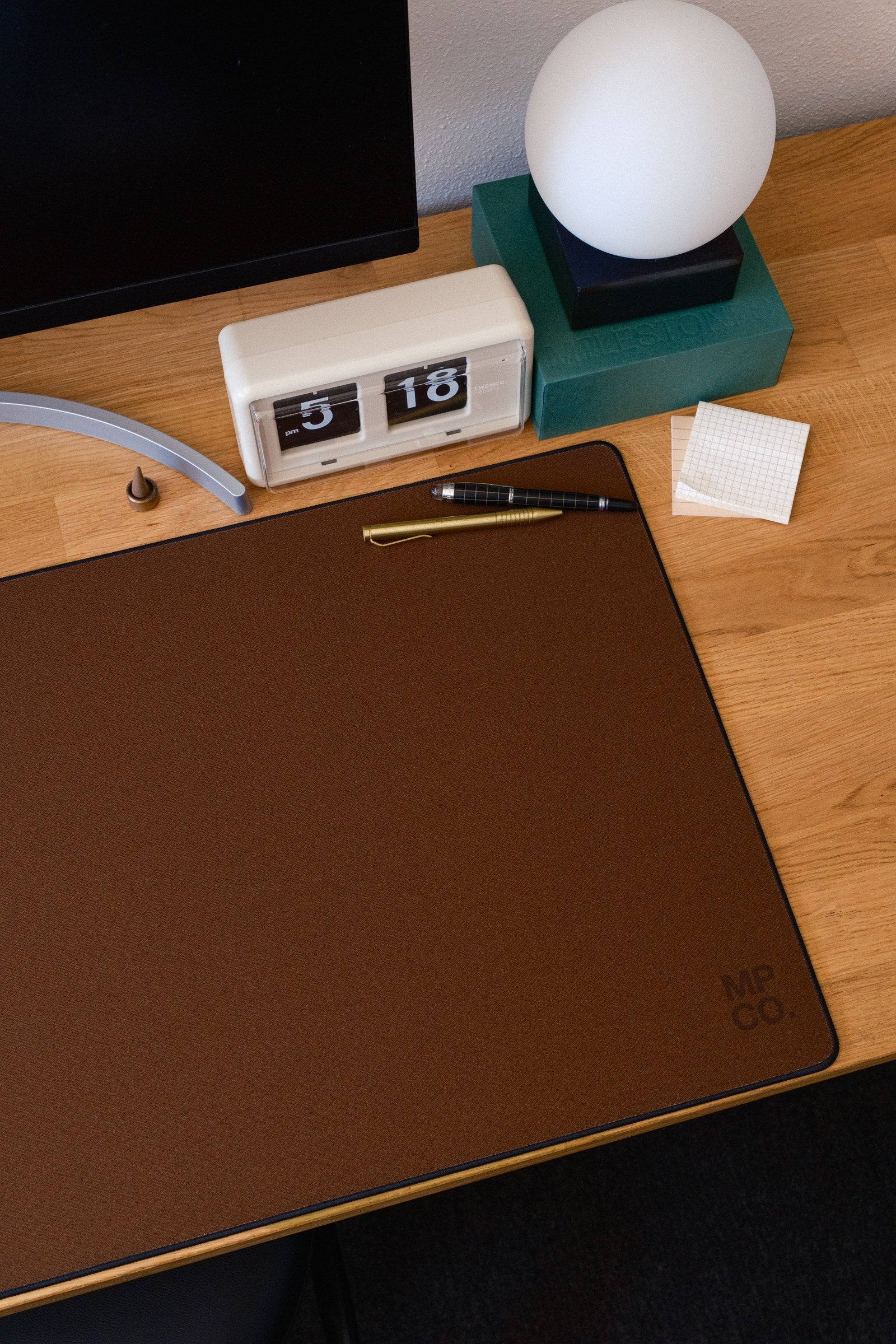 Solid Colors 2026 Summer desk mat in Espresso, shown on a styled desk setup