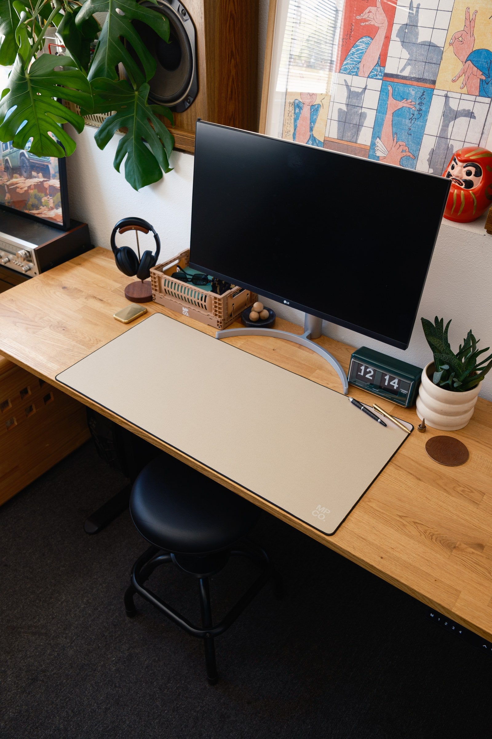 Solid Colors 2026 Summer desk mat in Oat_Milk, shown on a styled desk setup