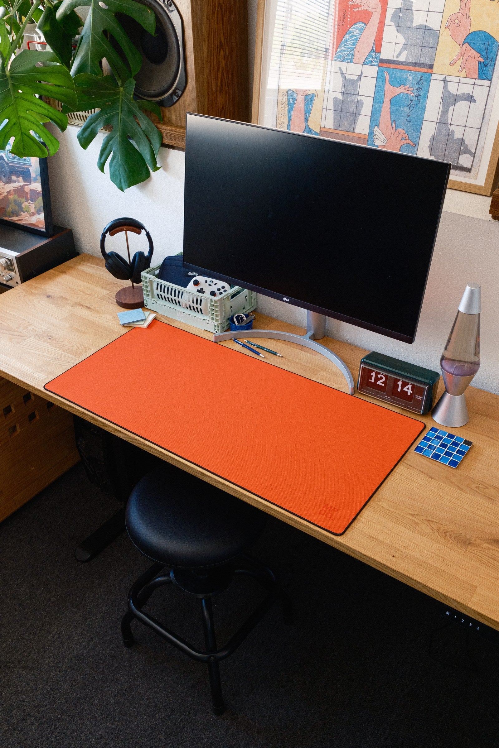 Solid Colors 2026 Summer desk mat in Orange, shown on a styled desk setup