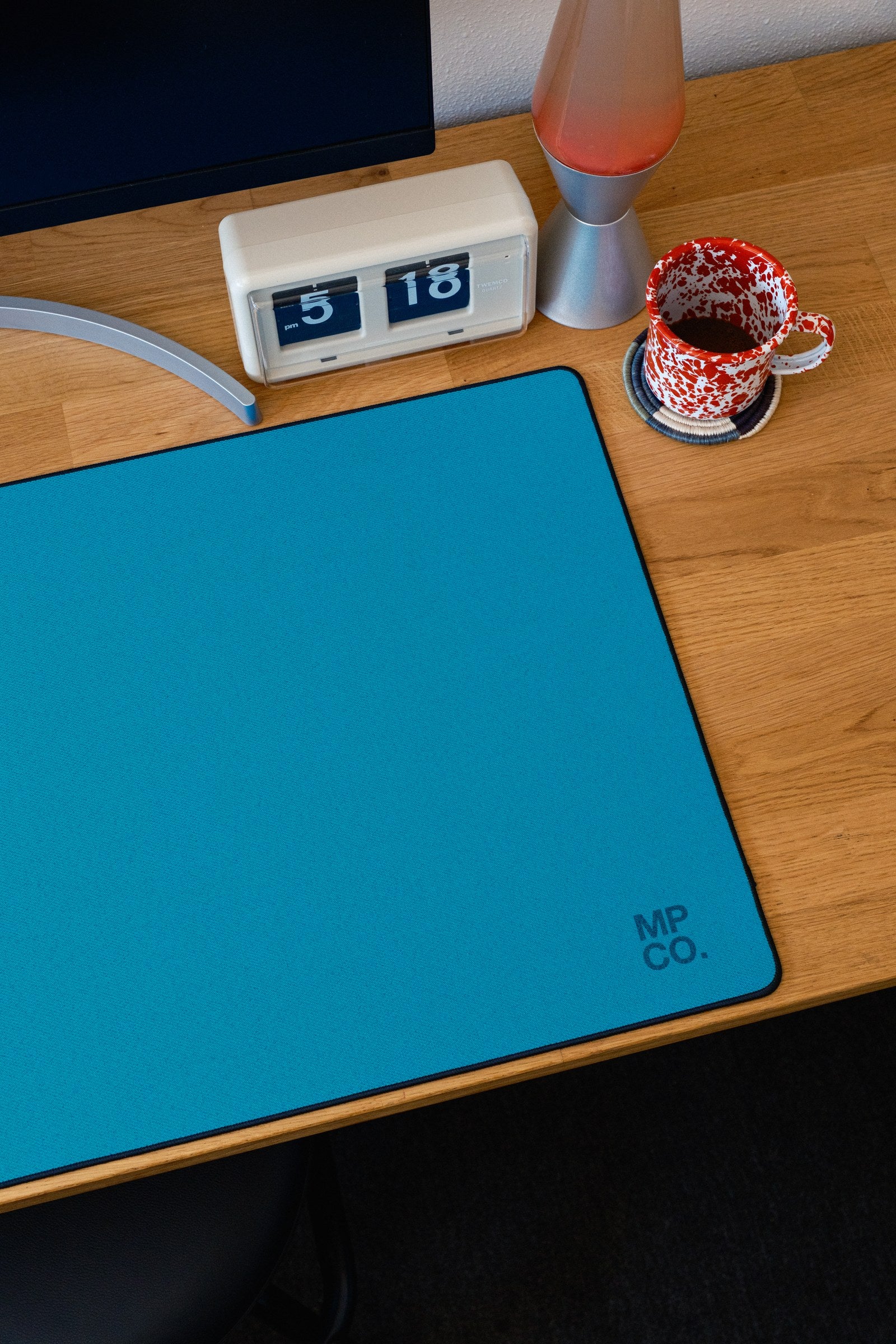 Solid Colors 2026 Summer desk mat in Teal, shown on a styled desk setup