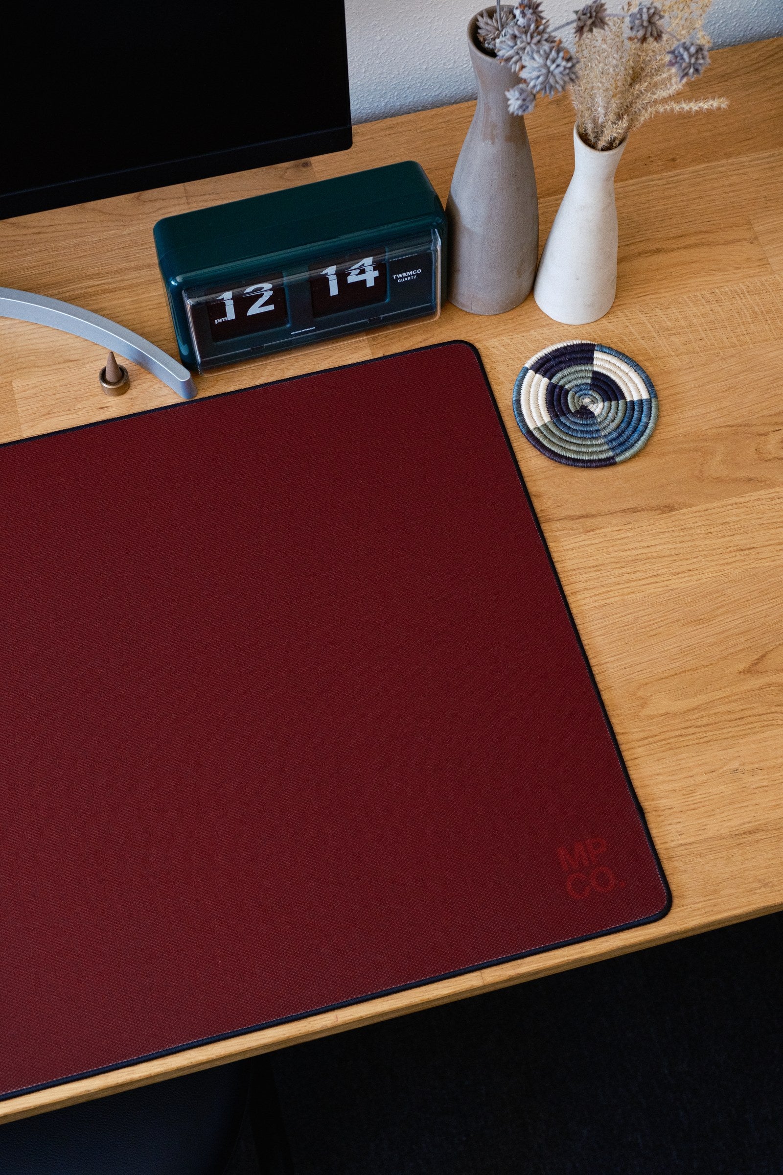 Solid Colors 2026 Summer desk mat in Wine, shown on a styled desk setup