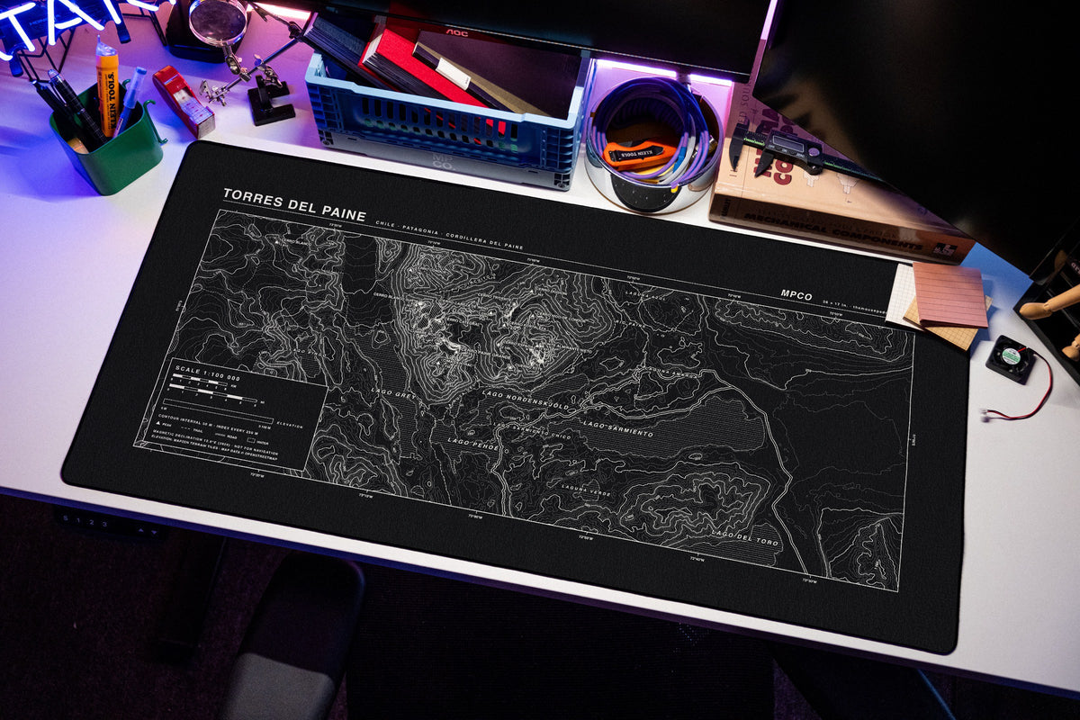 Torres del Paine Topo Pad desk mat in Black / White, shown on a styled desk setup