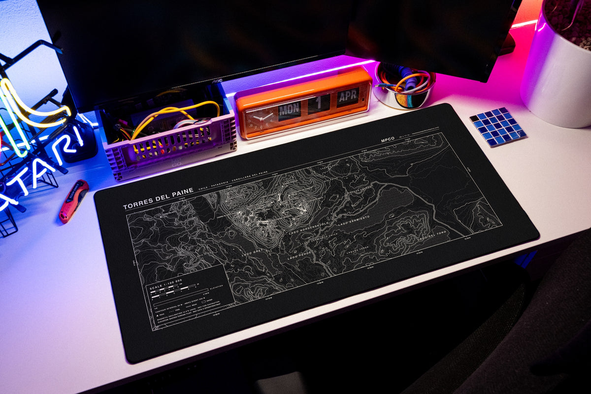 Torres del Paine Topo Pad desk mat in Black / White, shown on a styled desk setup