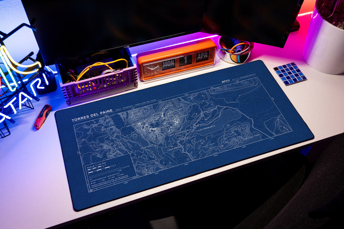 Torres del Paine Topo Pad desk mat in Blue / White, shown on a styled desk setup