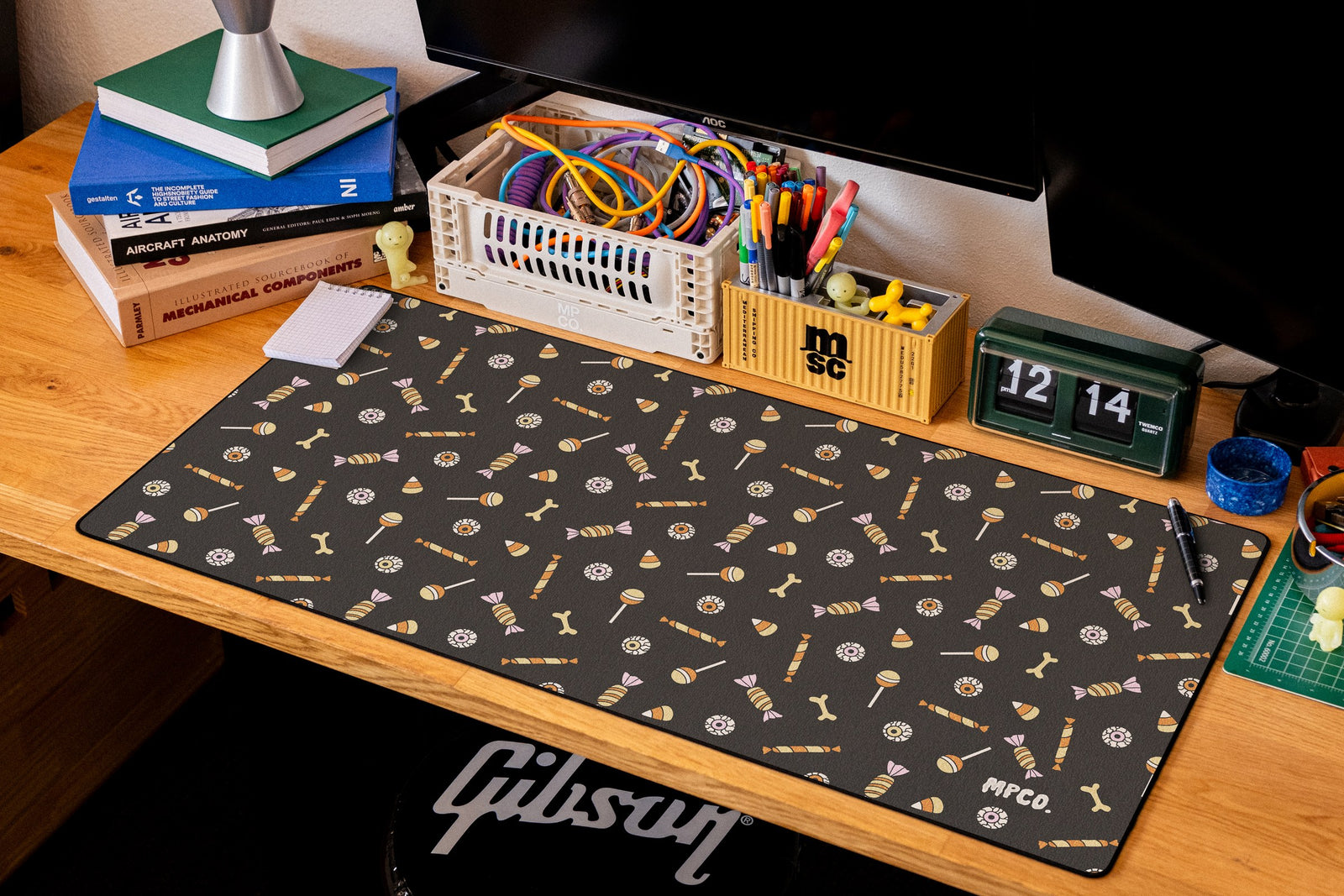 Trick or Treat desk mat in Black, shown on a styled desk setup