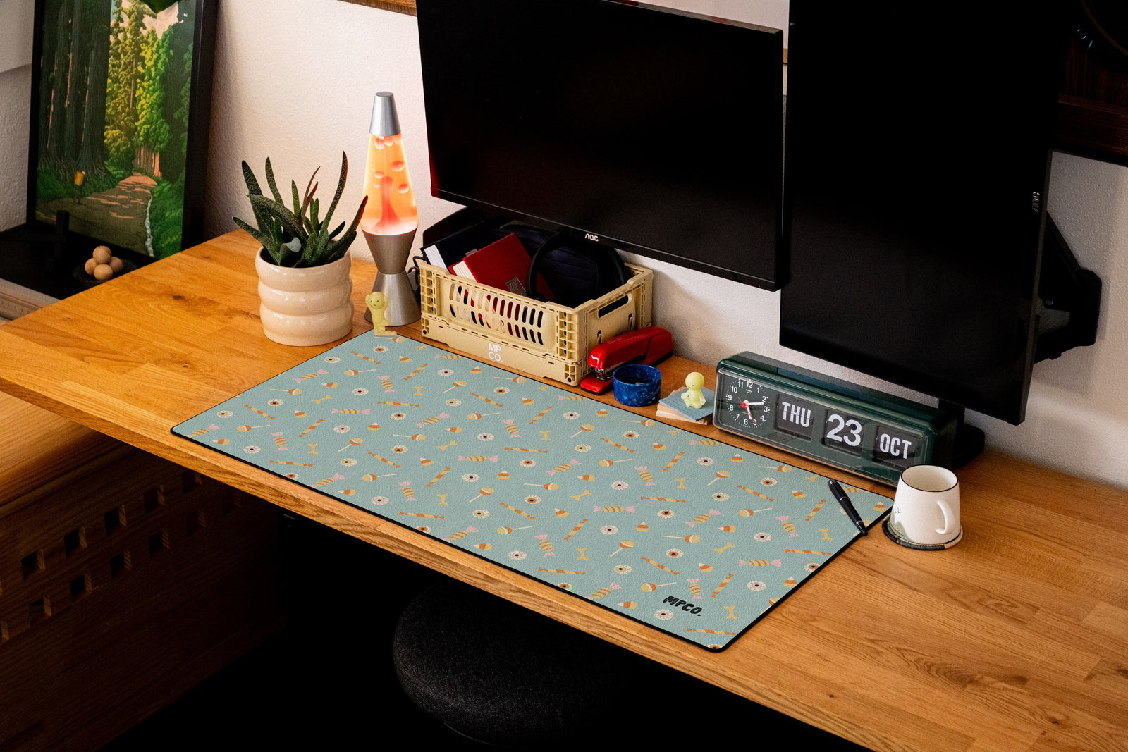 Trick or Treat desk mat in Blue, shown on a styled desk setup