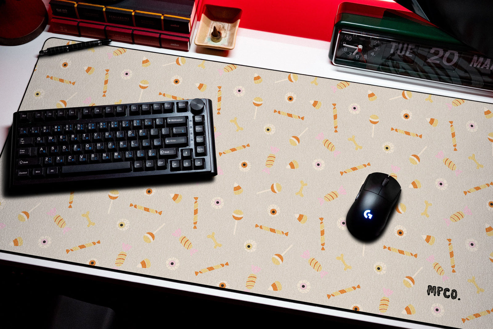 Trick or Treat desk mat in Cream, shown on a styled desk setup
