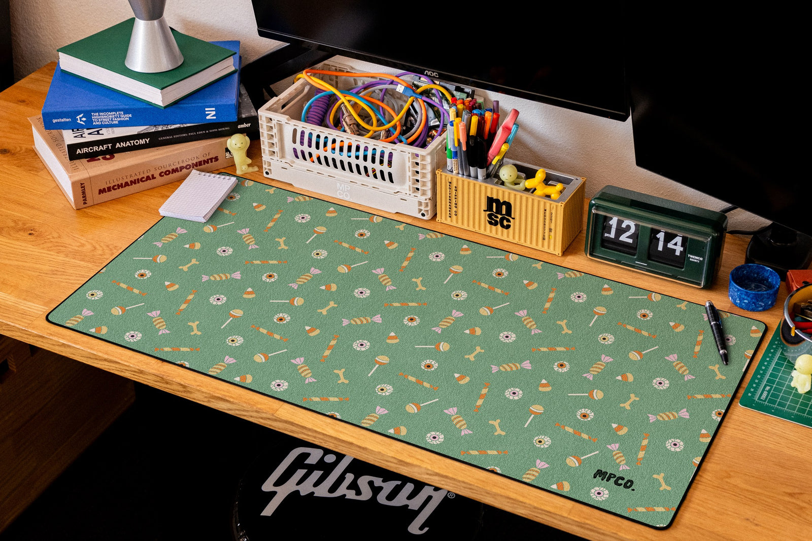 Trick or Treat desk mat in Green, shown on a styled desk setup