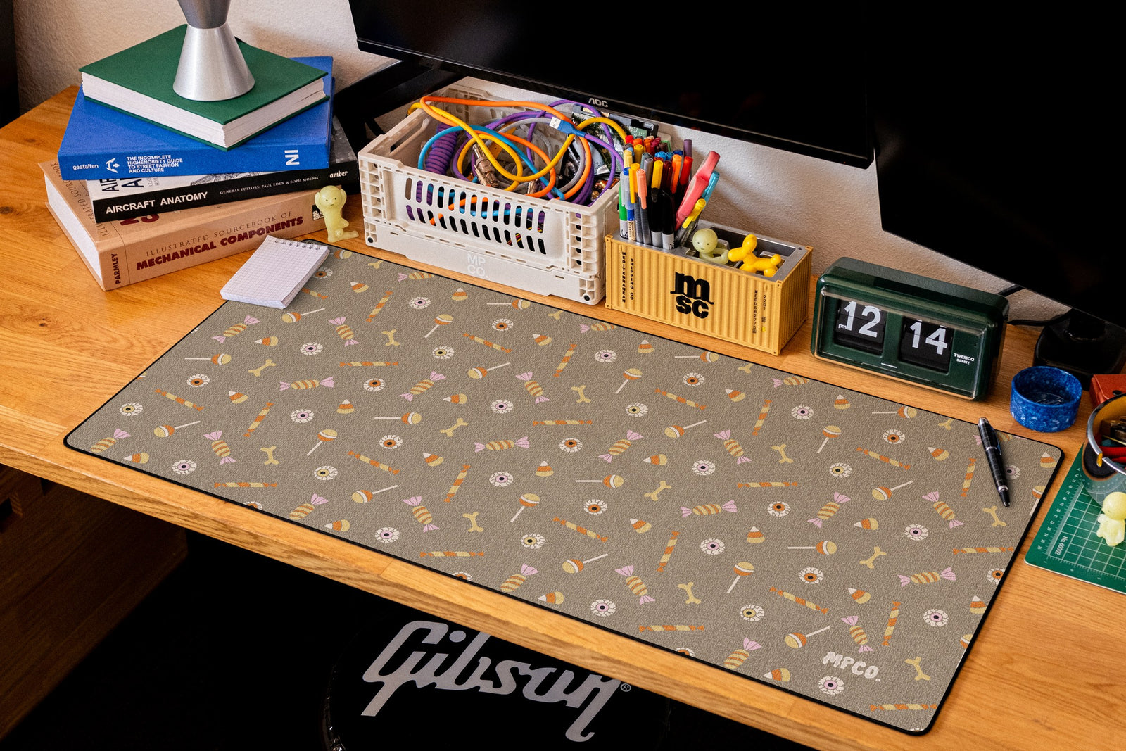 Trick or Treat desk mat in Sand, shown on a styled desk setup