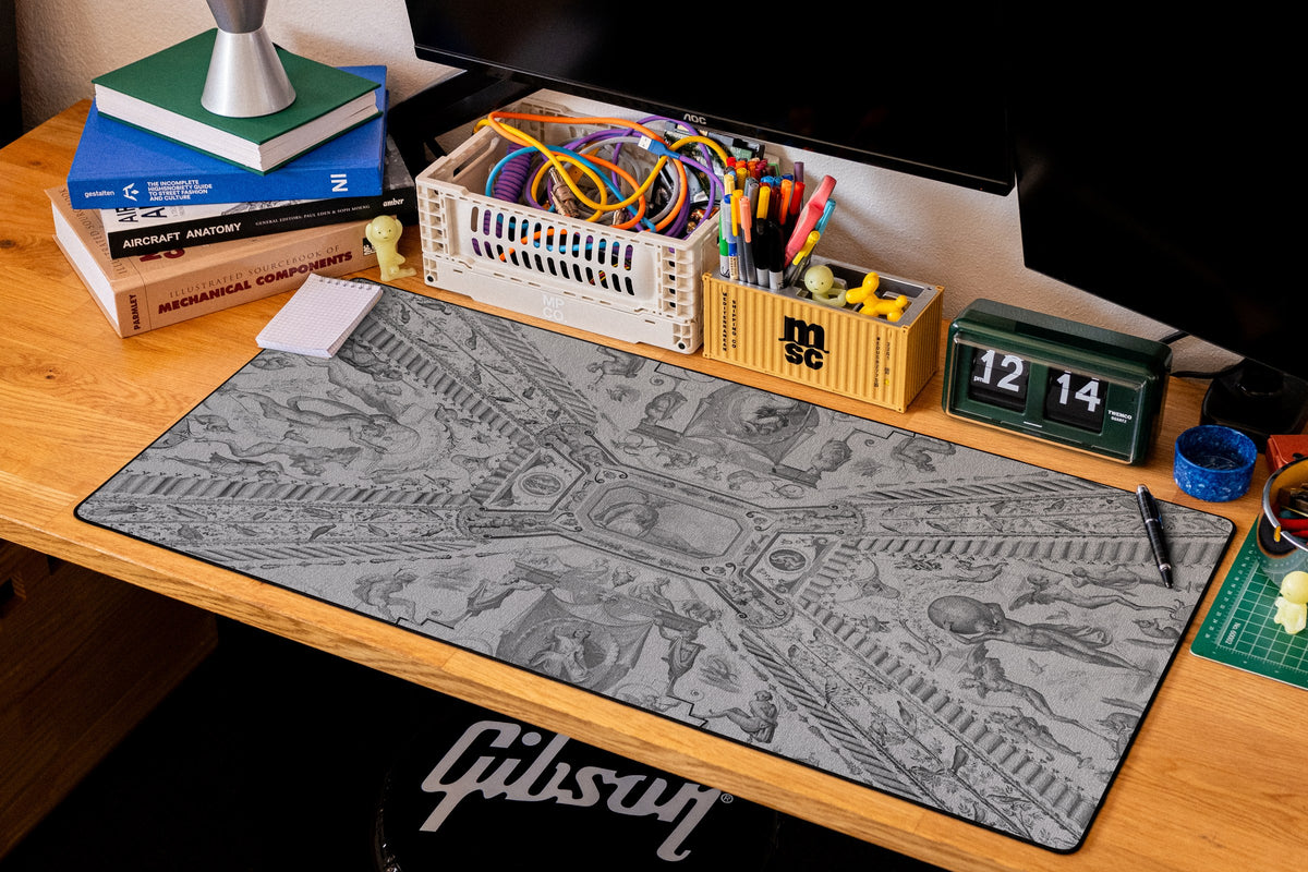 Twin Globes desk mat in Dark, shown on a styled desk setup