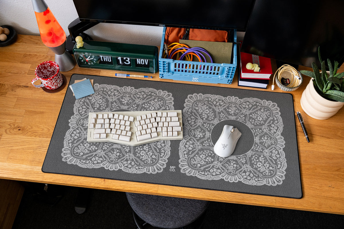 Twin Veil desk mat in Ivory, shown on a styled desk setup