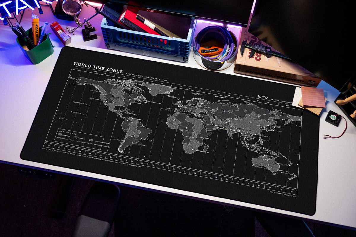 World Time Zones Map Pad desk mat in Black / White, shown on a styled desk setup