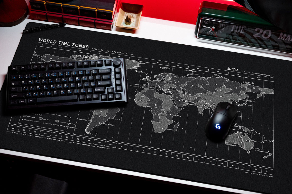 World Time Zones Map Pad desk mat in Black / White, shown on a styled desk setup