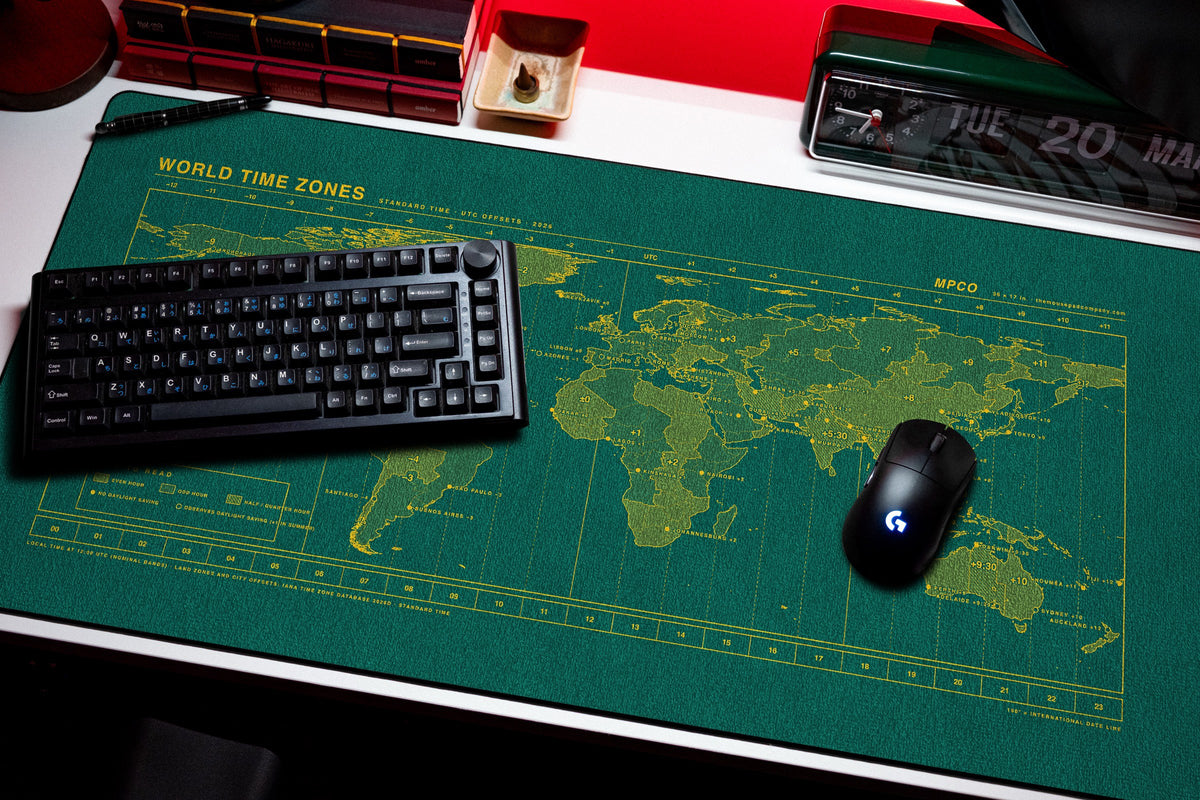 World Time Zones Map Pad desk mat in Green / Yellow, shown on a styled desk setup