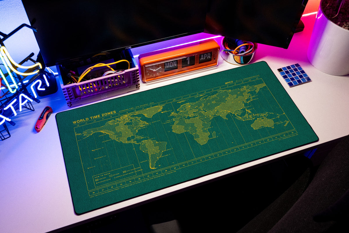 World Time Zones Map Pad desk mat in Green / Yellow, shown on a styled desk setup