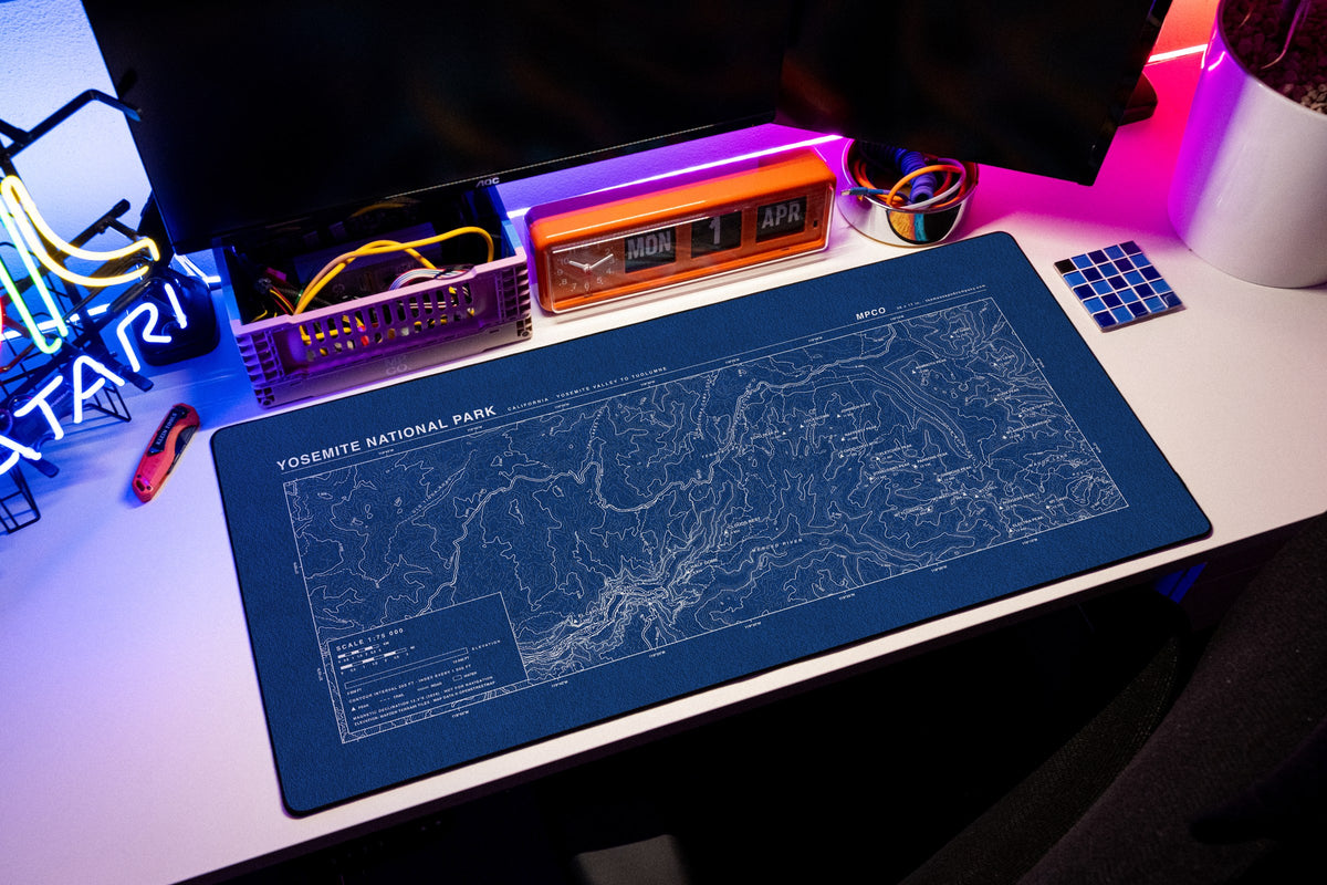 Yosemite National Park Topo Pad desk mat in Blue / White, shown on a styled desk setup