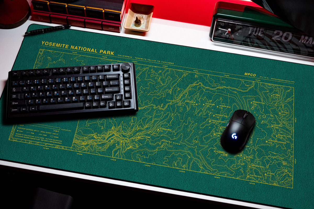 Yosemite National Park Topo Pad desk mat in Green / Yellow, shown on a styled desk setup