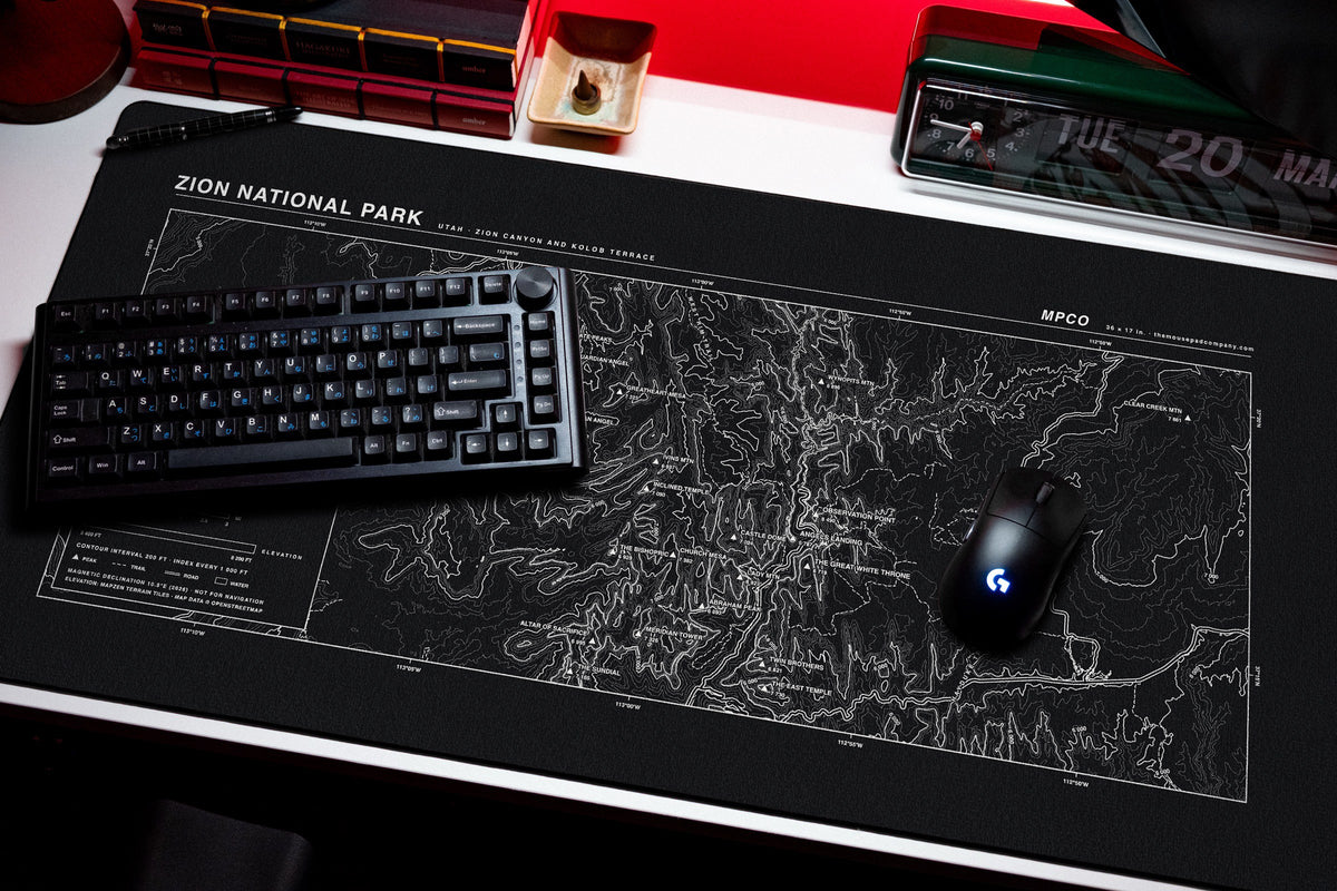 Zion National Park Topo Pad desk mat in Black / White, shown on a styled desk setup